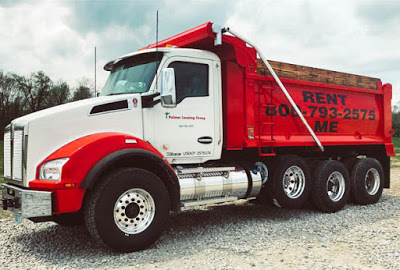 A Kenworth® rental dump truck with "Rent Me 800-793-2575" on the side