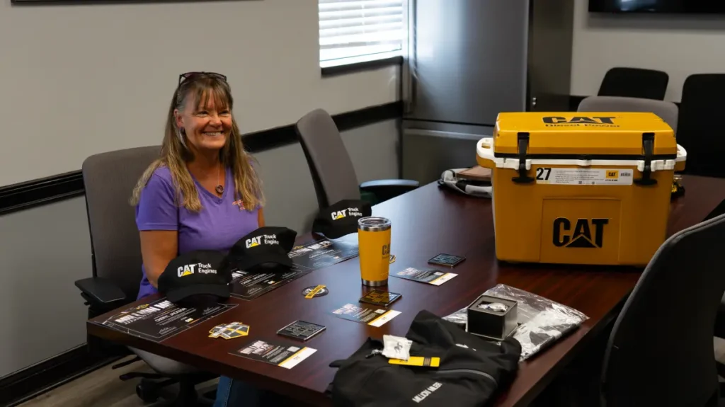 Cheryl receiving million miler awards from CAT at Kenworth of Fort Wayne