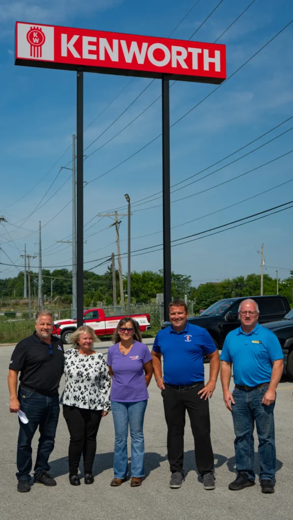 Employee’s from CAT and Palmer Trucks with Cheryl outside of Kenworth of Fort Wayne